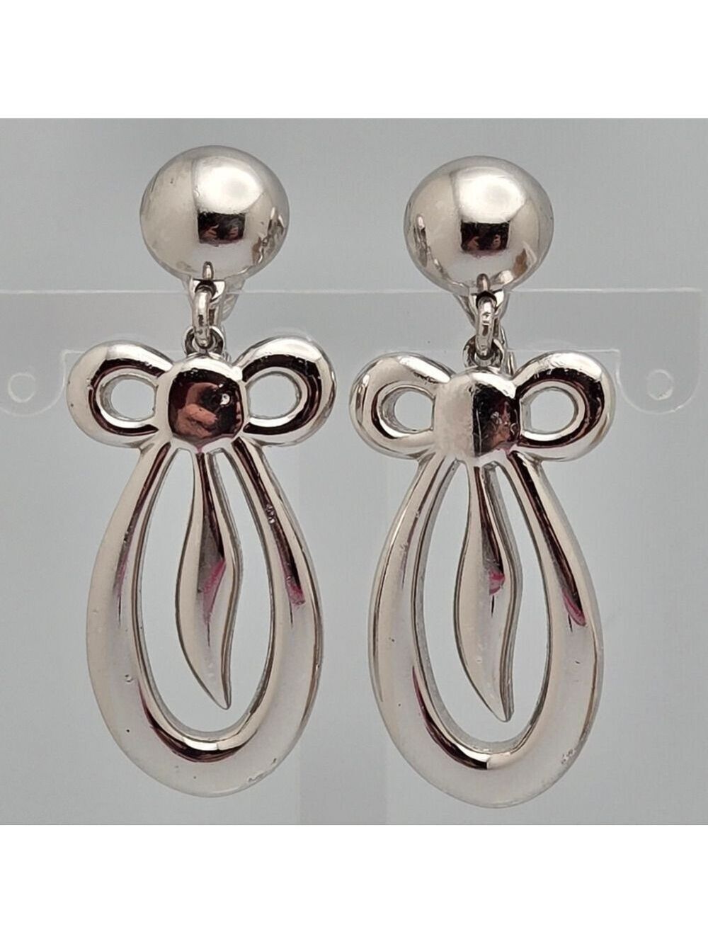 Vintage Monet Silver Bow Drop Clip-On Earrings Retro Dangle